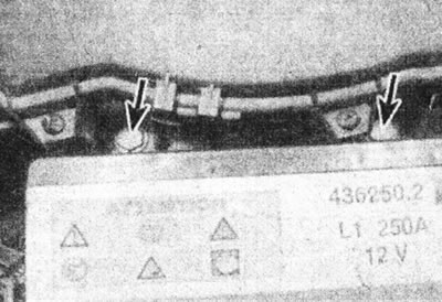 2.7. Unscrew the two bolts (marked with arrows), fastening the air filter to the battery platform -…
