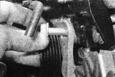5.45 Remove the bolt securing the alternator mounting plate to the power steering pump bracket -…