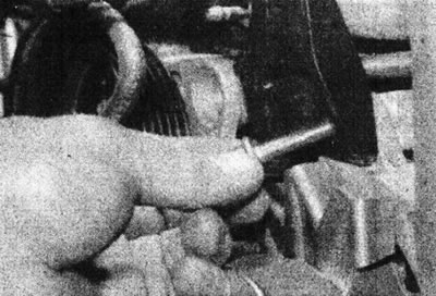 5.46 Remove the bolt securing the generator to the mounting plate - F7P engine(with 16 valves).