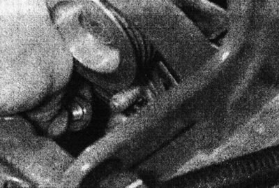 5.49a. Remove the generator lower mounting nut...