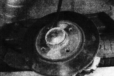 18.5. Press the hub cap out of the rear brake disc.
