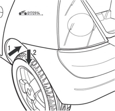Рис. 9.14. Отсоединение угла бампера (стрелка 1) и направление его поворота (стрелка 2)