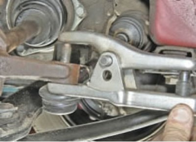 Loosen the nuts securing the ball joints of the steering rod ends. Disconnect the rods from the…