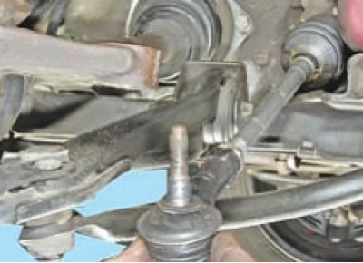 Loosen the nuts securing the ball joints of the steering rod ends. Disconnect the rods from the…